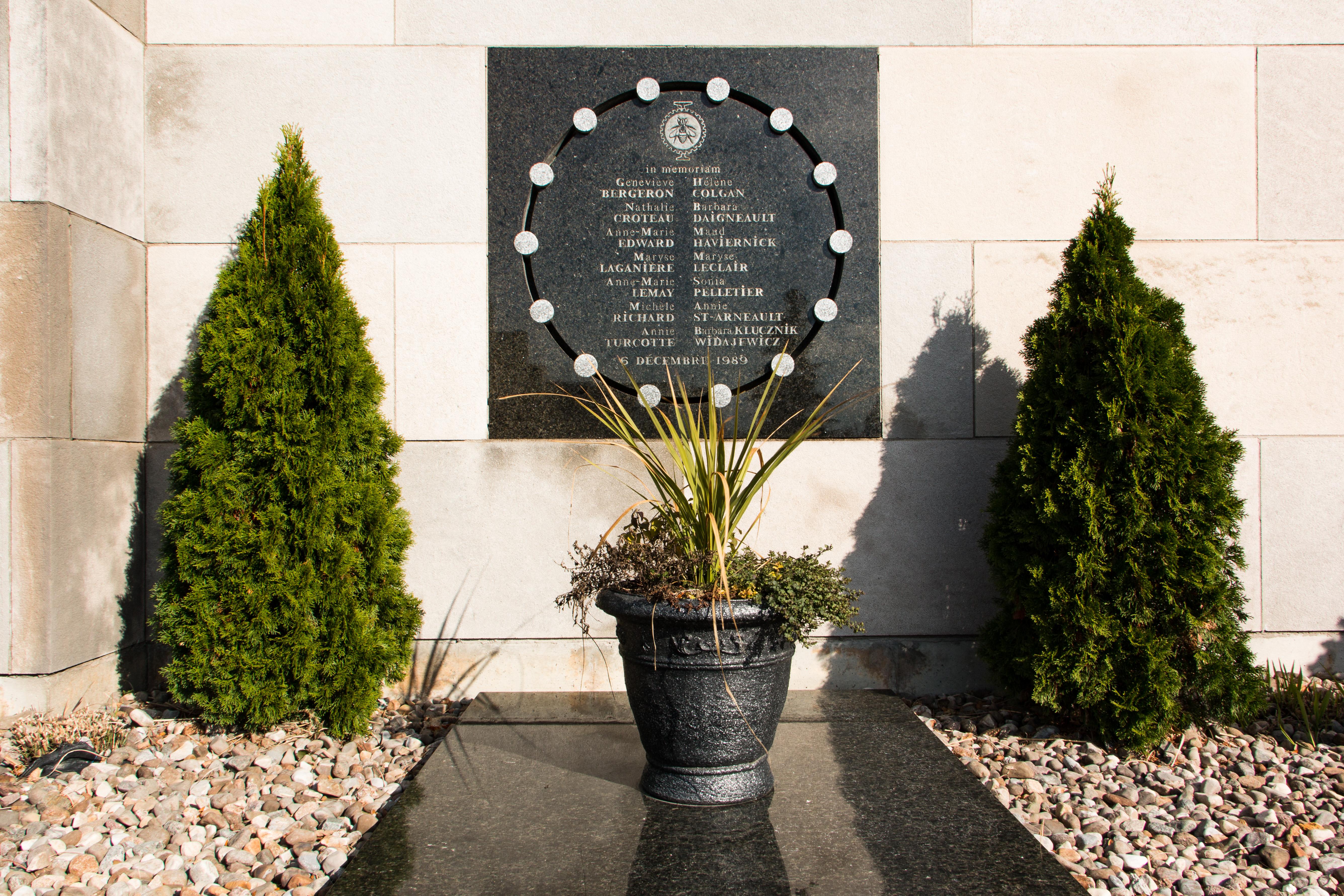 Plaque on the exterior wall of École Polytechnique commemorating the victims of the massacre. (Photo: Josie Desmarais)