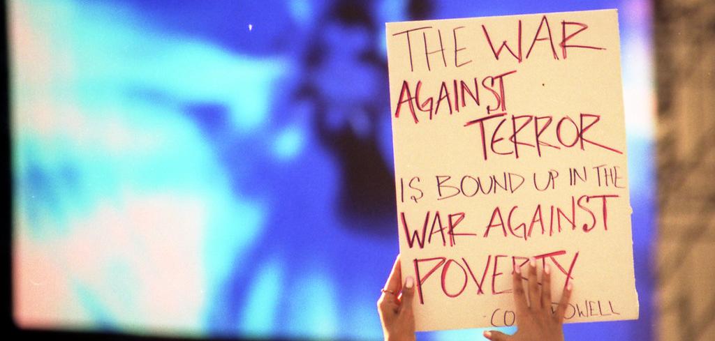 A sign that reads: The War Against Terror is bound up in the War Against Poverty