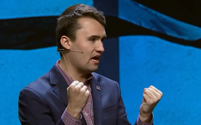 Charlie Kirk talking into a mic